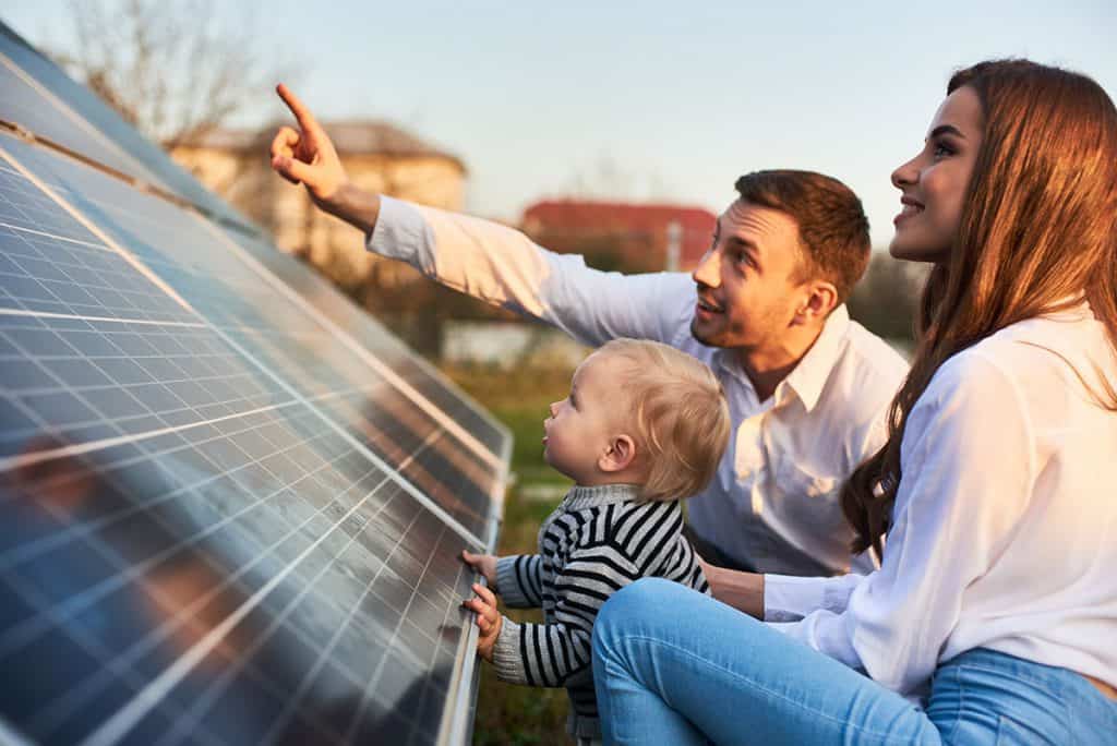 family-looking-at-new-solar-panels